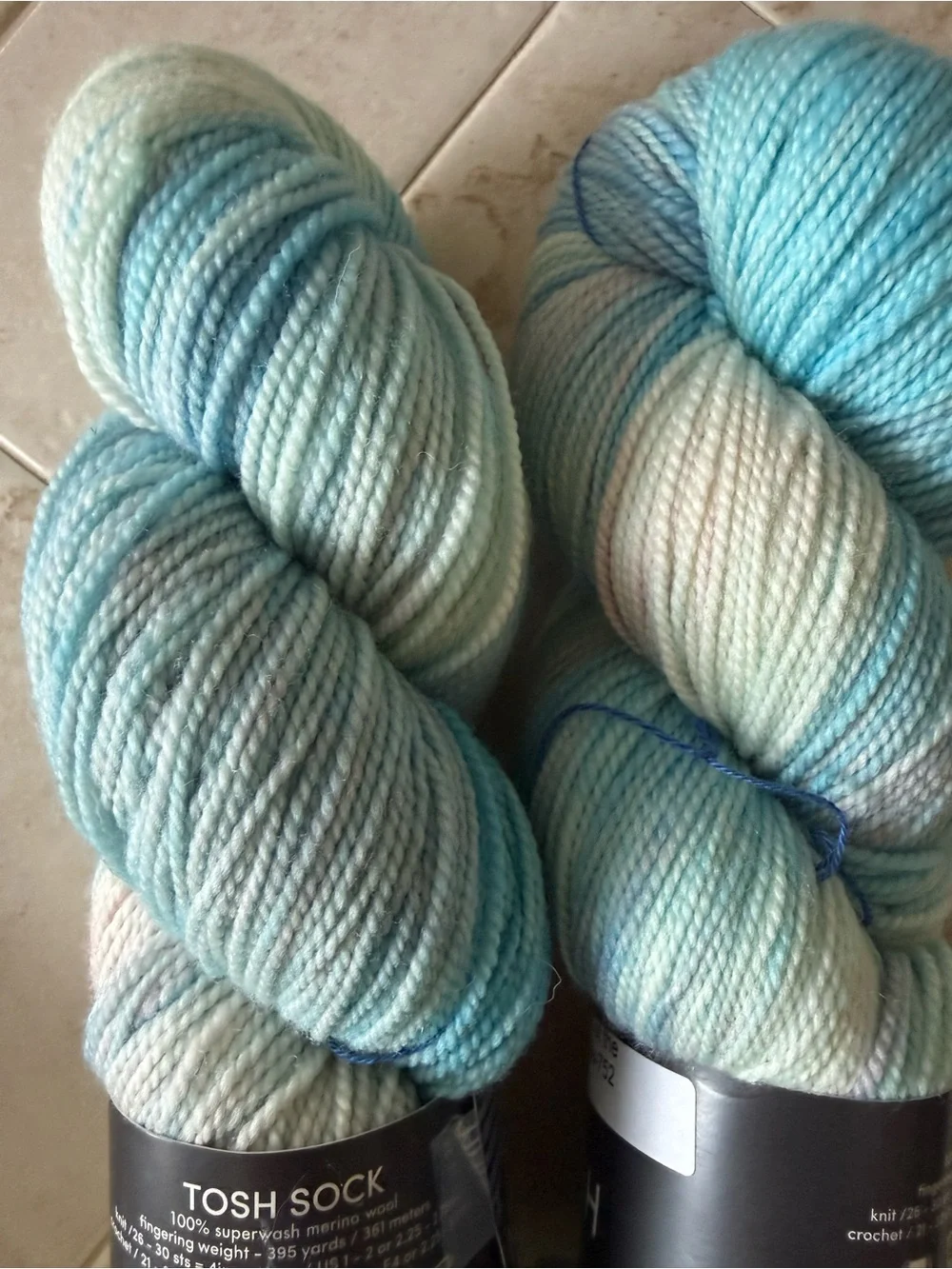 Madelinetosh Hand-Dyed Yarn Skeins in Aqua and Pale Blue